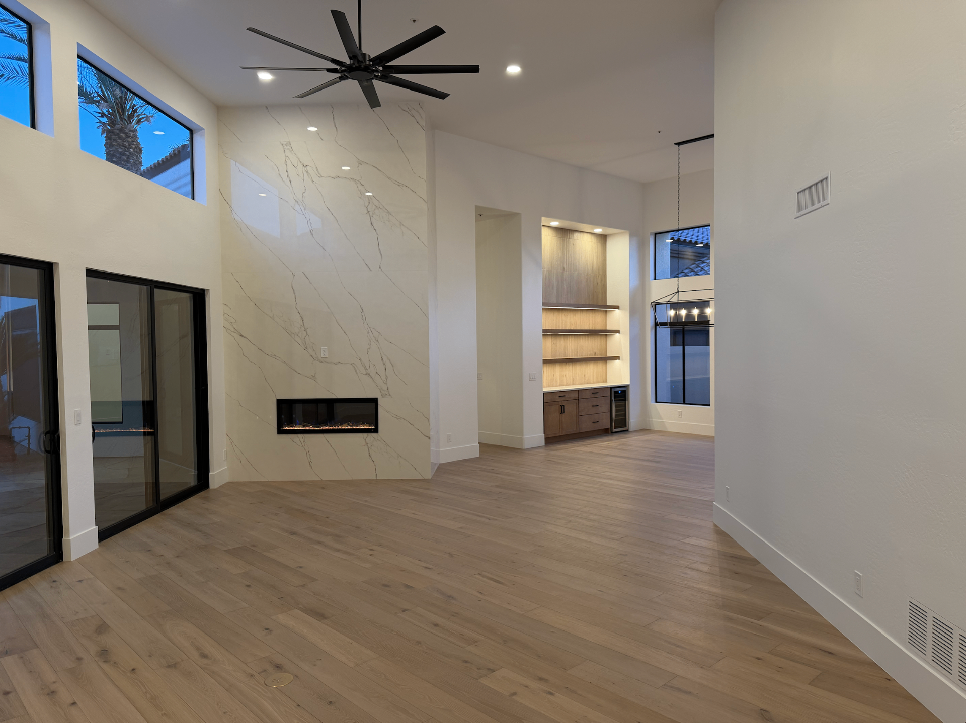 Luxury Scottsdale great room with marble fireplace and custom built-ins